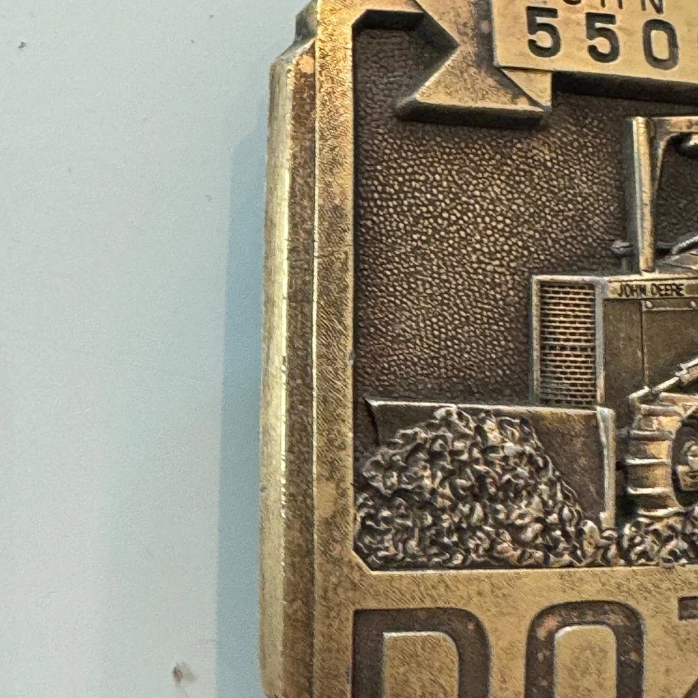 John Deere vintage brass